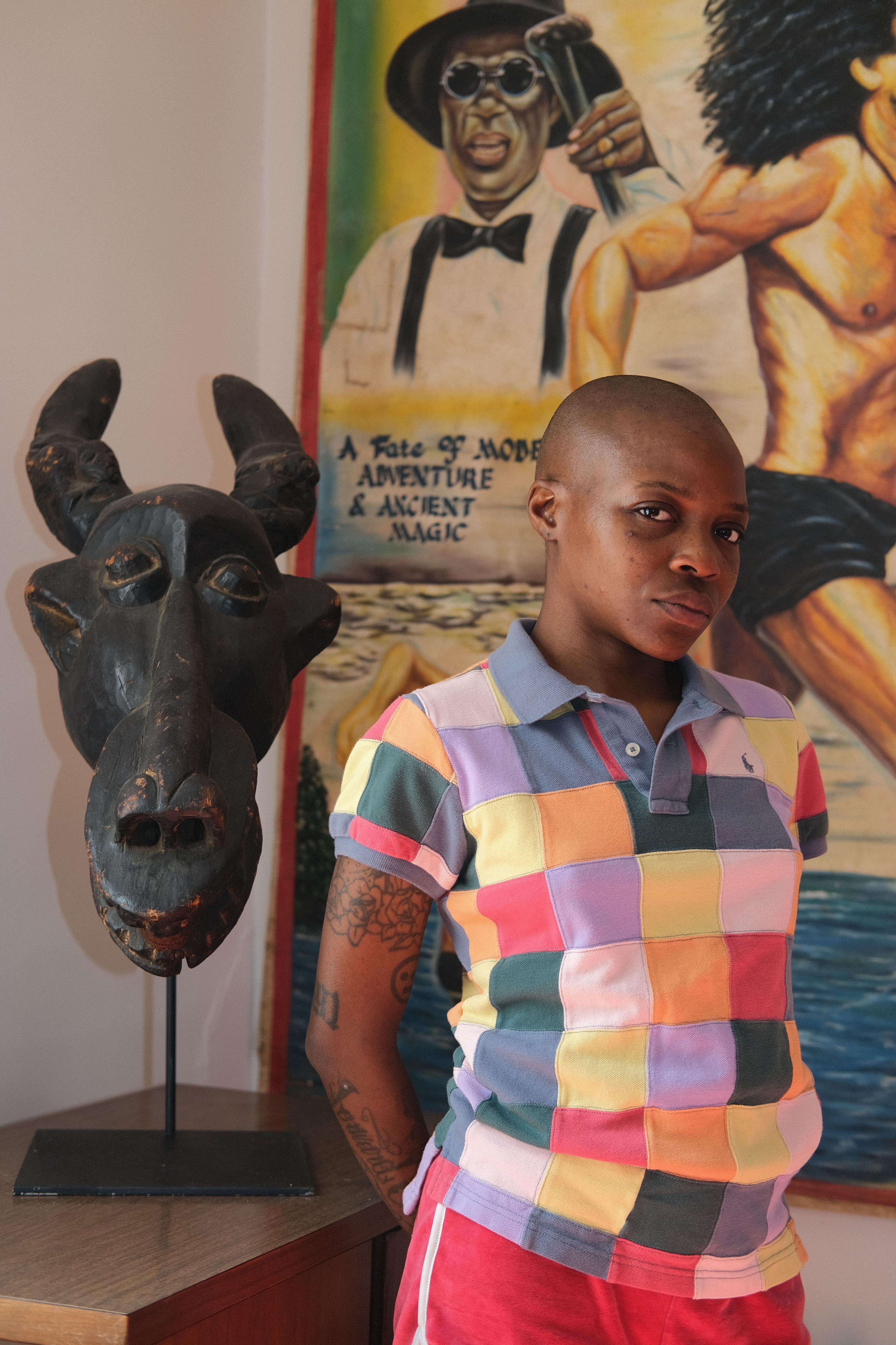 Melinda next to her art collection