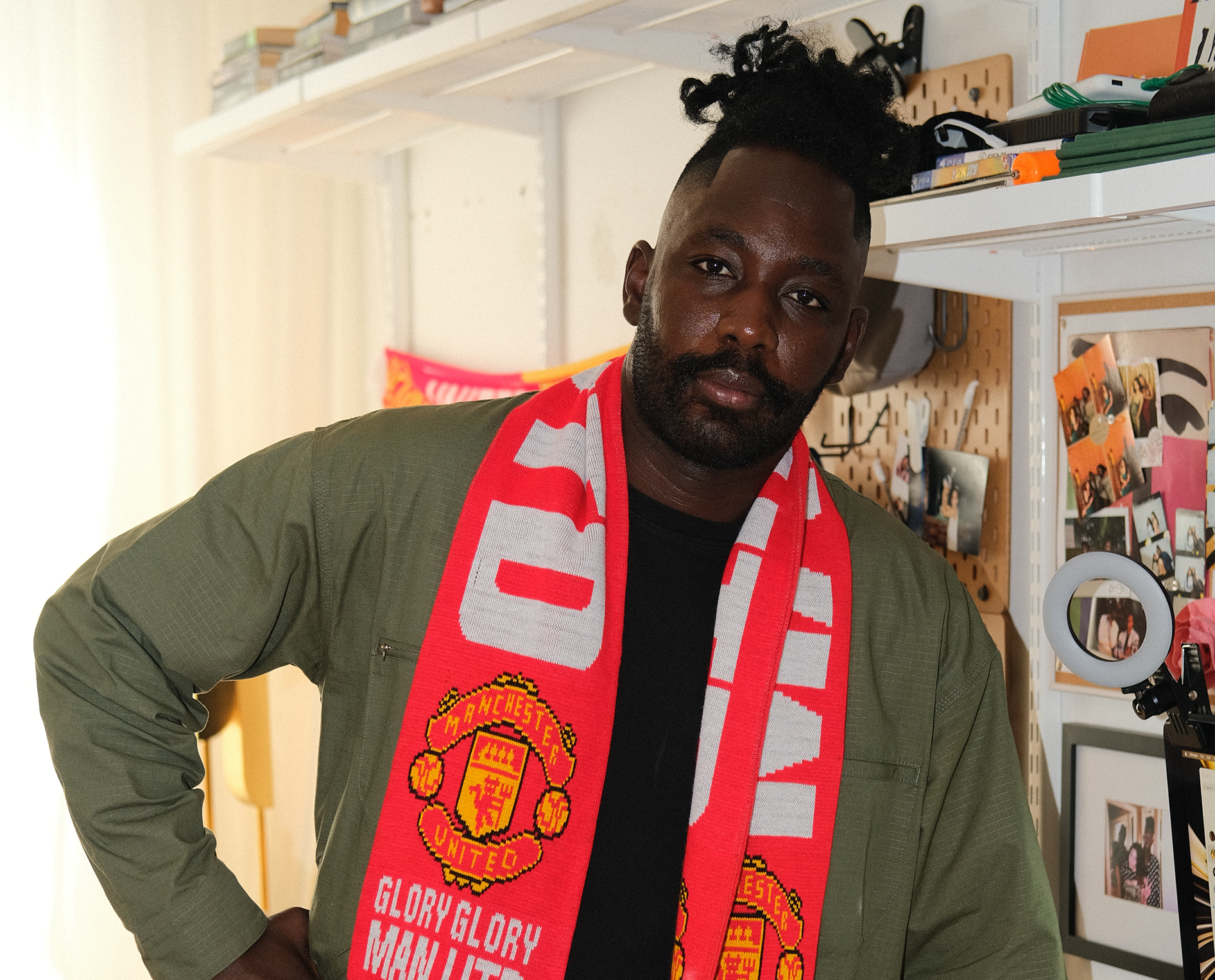 A portrait of Olu Alege in his home office